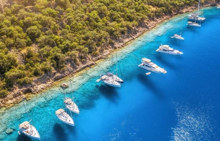 Yachts and boats in Bodrum the clear blue sea Bodrum near Gemiler Island at sunset, Turkish Riviera