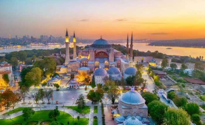 Hagia Sophia and Blue Mosque with Istanbul skyline at sunset, Turkey