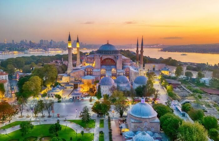 Hagia Sophia and Blue Mosque with Istanbul skyline at sunset, Turkey