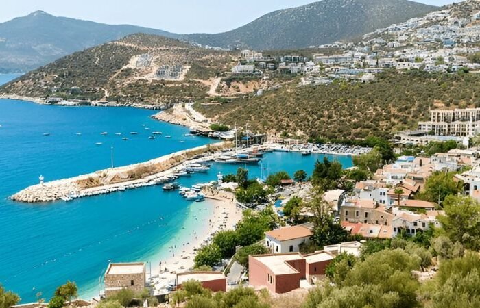 Coastal town of Kalkan, Antalya, Turkey with beach and harbor view