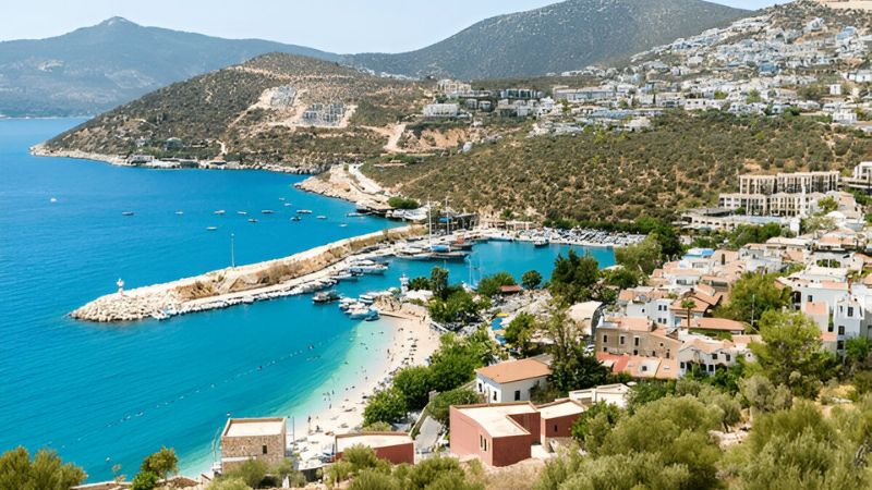 Coastal town of Kalkan, Antalya, Turkey with beach and harbor view