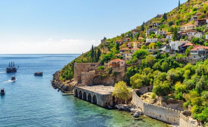 View of Alanya Tersane (shipyard) and boats by the coast in Alanya, Turkey