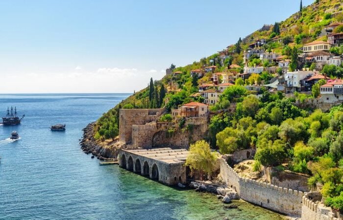 View of Alanya Tersane (shipyard) and boats by the coast in Alanya, Turkey